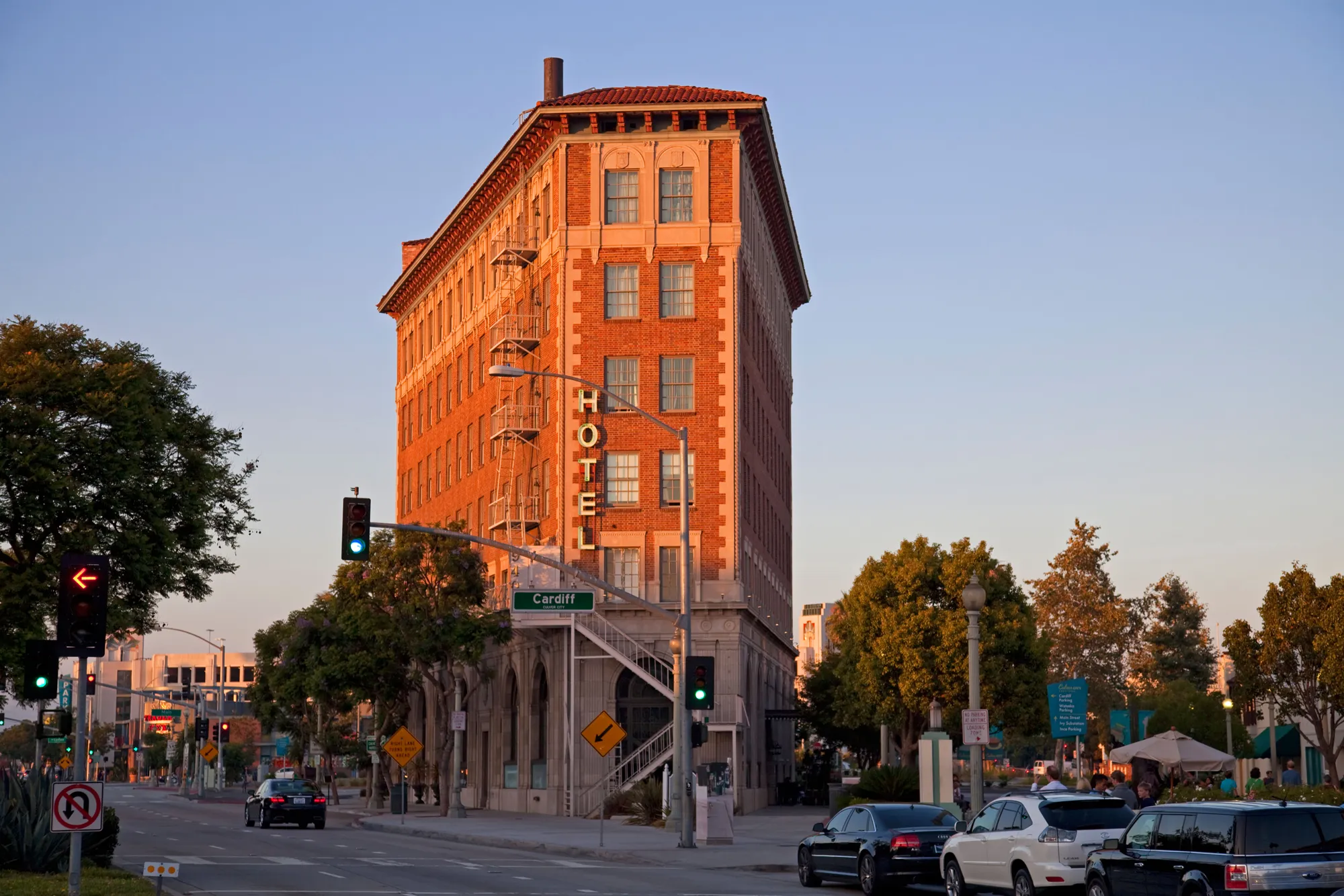 Historic Culver Hotel and downtown Culver City street corner at golden hour